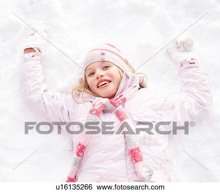 Girl Laying On Ground Making Snow Angel View Large Photo Image Stock Photograph - Girl Laying On Ground Making Snow Angel. Fotosearch