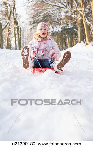 Girl Sledging Through Snowy Woodland View Large Photo Image Stock Image - Girl Sledging Through Snowy Woodland. Fotosearch