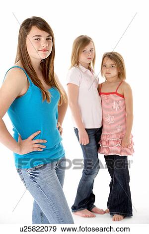 Stock Photo - Group Of Girls Together In Studio Looking Unhappy. Fotosearch