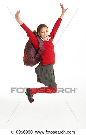 Stock Image - Happy Female Student In Uniform Jumping In Air. Fotosearch