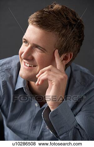 Head And Shoulders Portrait Of Young Man In Studio View Large Photo Image Stock Photo - Head And Shoulders Portrait Of Young Man In Studio. Fotosearch