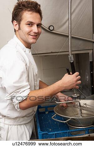 Kitchen Worker Washing Up In Restaurant Kitchen View Large Photo Image Stock Photo - Kitchen Worker Washing Up In Restaurant Kitchen. Fotosearch