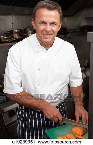 Male Chef Preparing Vegetables In Restaurant Kitchen View Large Photo Image Stock Image - Male Chef Preparing Vegetables In Restaurant Kitchen. Fotosearch