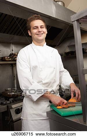 Stock Photography - Male Chef Preparing Vegetables In Restaurant Kitchen. Fotosearch