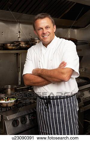 Male Chef Standing Next To Cooker In Restaurant Kitchen View Large Photo Image Stock Image - Male Chef Standing Next To Cooker In Restaurant Kitchen. Fotosearch