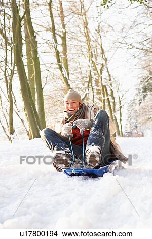 Man Sledging Through Snowy Woodland View Large Photo Image Picture - Man Sledging Through Snowy Woodland. Fotosearch