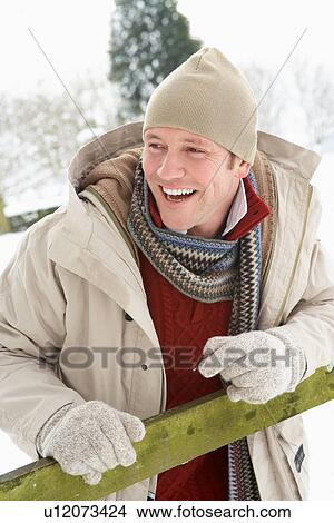 Man Standing Outside In Snowy Landscape View Large Photo Image Picture - Man Standing Outside In Snowy Landscape. Fotosearch