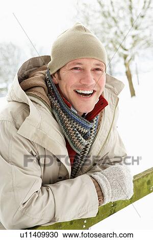 Man Standing Outside In Snowy Landscape View Large Photo Image Stock Image - Man Standing Outside In Snowy Landscape. Fotosearch
