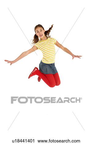 Mid Air Studio Shot Of Young Girl Jumping In Air View Large Photo Image Stock Image - Mid Air Studio Shot Of Young Girl Jumping In Air. Fotosearch
