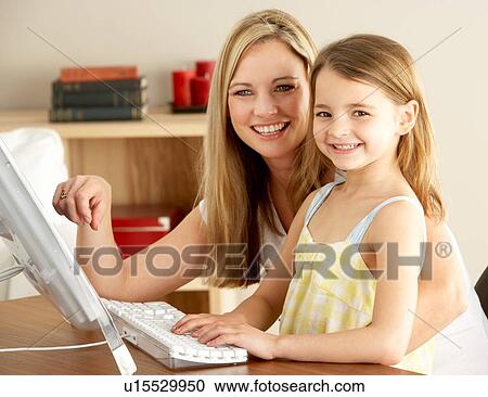 Mother And Daughter At Home Using Computer View Large Photo Image Stock Image - Mother And Daughter At Home Using Computer. Fotosearch