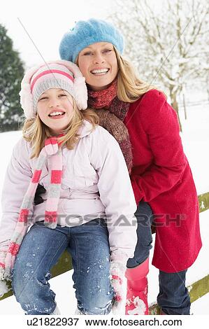 Mother And Daughter Standing Outside In Snowy Landscape View Large Photo Image Stock Photo - Mother And Daughter Standing Outside In Snowy Landscape. Fotosearch