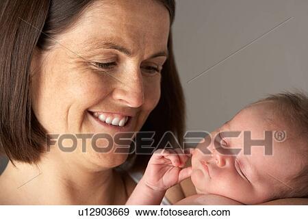 Mother Holding Newborn Baby View Large Photo Image Stock Photo - Mother Holding Newborn Baby. Fotosearch