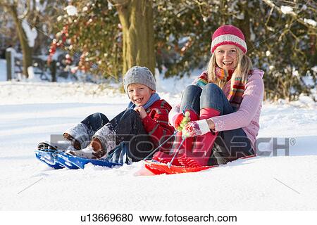 Mother Riding On SledgesThrough Snowy Landscape View Large Photo Image Stock Image - Mother Riding On SledgesThrough Snowy Landscape. Fotosearch