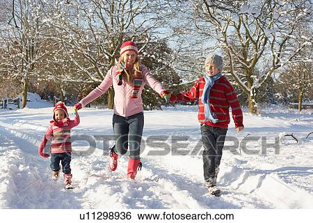 Mother Walking With Children Through Snowy Landscape View Large Photo Image Stock Photograph - Mother Walking With Children Through Snowy Landscape. Fotosearch