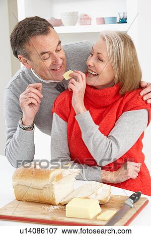 Senior Couple Making Sandwich In Kitchen View Large Photo Image Stock Photo - Senior Couple Making Sandwich In Kitchen. Fotosearch
