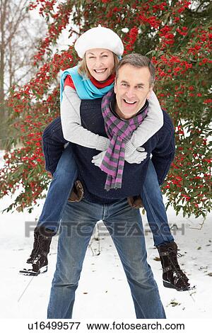 Senior Couple Outside In Snowy Landscape View Large Photo Image Stock Photo - Senior Couple Outside In Snowy Landscape. Fotosearch
