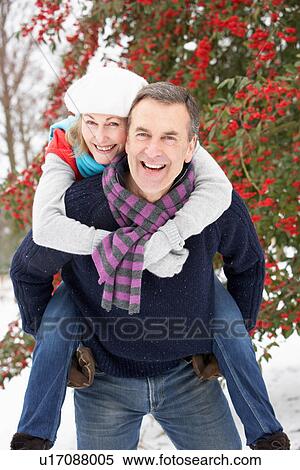 Senior Couple Outside In Snowy Landscape View Large Photo Image Stock Photography - Senior Couple Outside In Snowy Landscape. Fotosearch