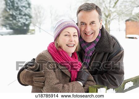 Senior Couple Standing Outside In Snowy Landscape View Large Photo Image Picture - Senior Couple Standing Outside In Snowy Landscape. Fotosearch