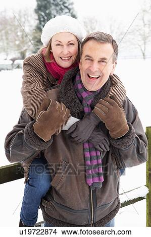 Senior Couple Standing Outside In Snowy Landscape View Large Photo Image Picture - Senior Couple Standing Outside In Snowy Landscape. Fotosearch