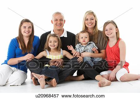 Shot Of Family Group Sitting In Studio View Large Photo Image Stock Photo - Shot Of Family Group Sitting In Studio. Fotosearch