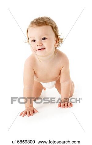 Stock Image - Studio Portrait Of Baby Boy Crawling. Fotosearch