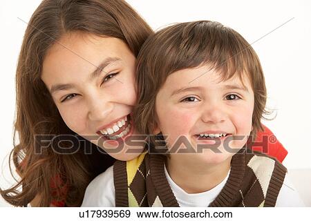 Stock Photo - Studio Portrait Of Brother And Sister. Fotosearch