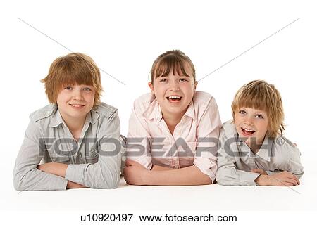 Studio Portrait Of Brothers And Sister View Large Photo Image Stock Photo - Studio Portrait Of Brothers And Sister. Fotosearch