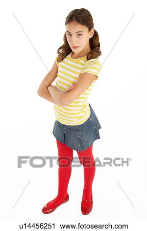 Stock Image - Studio Portrait Of Defiant Young Girl. Fotosearch
