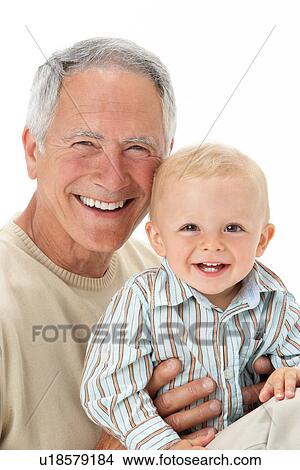 Studio Portrait Of Grandfather Holding Grandson View Large Photo Image Picture - Studio Portrait Of Grandfather Holding Grandson. Fotosearch