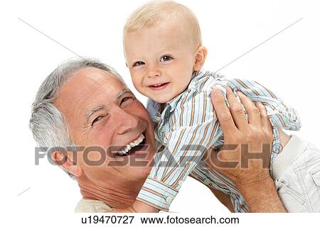 Studio Portrait Of Grandfather Holding Grandson View Large Photo Image Stock Photo - Studio Portrait Of Grandfather Holding Grandson. Fotosearch