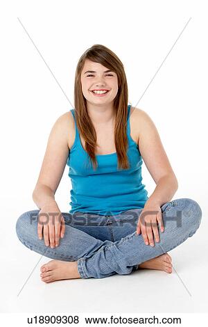 Stock Photo - Studio Portrait Of Happy Teenage Girl. Fotosearch