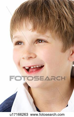 Stock Image - Studio Portrait Of Laughing Young Boy. Fotosearch