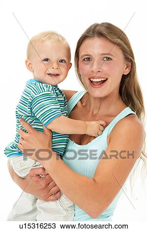 Studio Portrait Of Mother Holding Son View Large Photo Image Stock Image - Studio Portrait Of Mother Holding Son. Fotosearch
