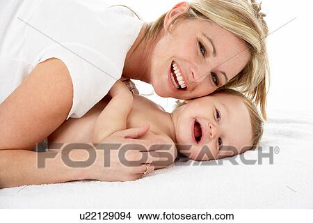 Picture - Studio Portrait Of Mother With Young Baby Boy. Fotosearch