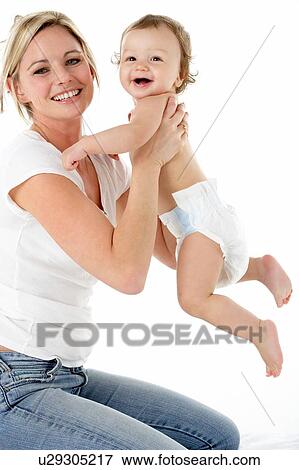Studio Portrait Of Mother With Young Baby Boy View Large Photo Image Stock Photo - Studio Portrait Of Mother With Young Baby Boy. Fotosearch