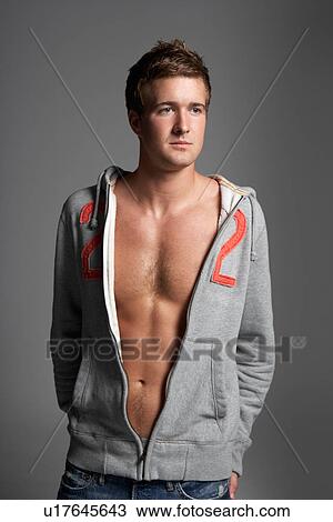 Studio Portrait Of Sexy Young Man Wearing Hooded Sweat Top View Large Photo Image Stock Image - Studio Portrait Of Sexy Young Man Wearing Hooded Sweat Top. Fotosearch