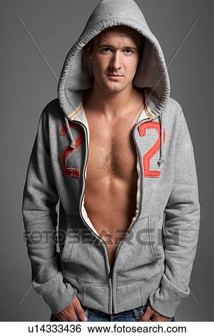 Studio Portrait Of Sexy Young Man Wearing Hooded Sweat Top View Large Photo Image Stock Photograph - Studio Portrait Of Sexy Young Man Wearing Hooded Sweat Top. Fotosearch