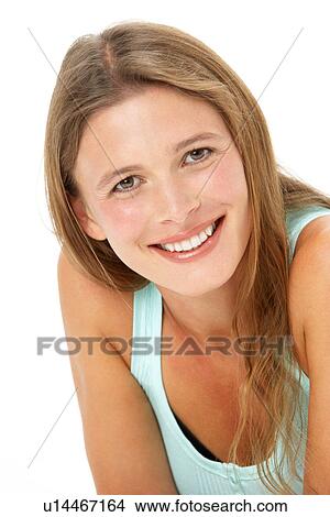 Studio Portrait Of Smiling Young Woman View Large Photo Image Picture - Studio Portrait Of Smiling Young Woman. Fotosearch