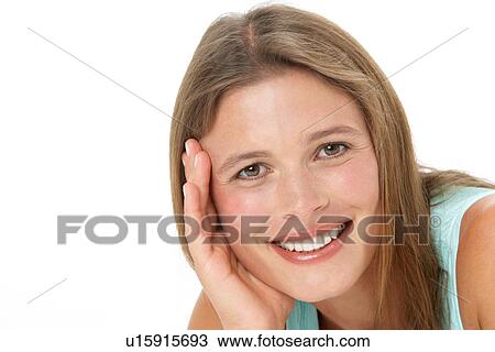 Studio Portrait Of Smiling Young Woman View Large Photo Image Stock Image - Studio Portrait Of Smiling Young Woman. Fotosearch