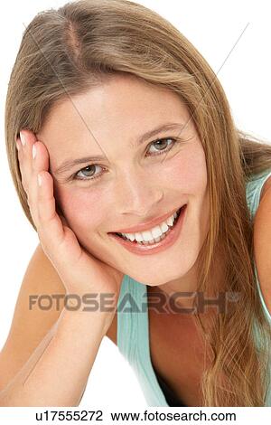Stock Image - Studio Portrait Of Smiling Young Woman. Fotosearch