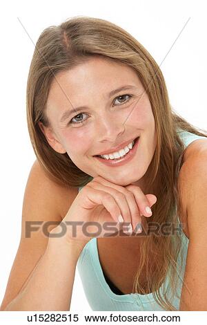 Studio Portrait Of Smiling Young Woman View Large Photo Image Stock Photography - Studio Portrait Of Smiling Young Woman. Fotosearch