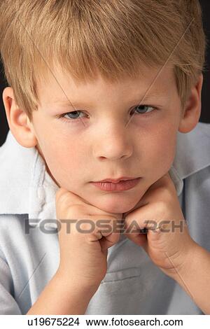 Picture - Studio Portrait Of Thoughtful Young Boy. Fotosearch