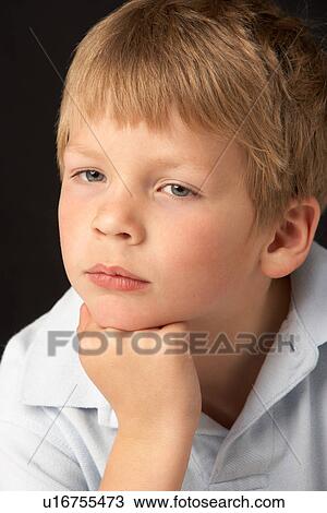 Studio Portrait Of Thoughtful Young Boy View Large Photo Image Stock Image - Studio Portrait Of Thoughtful Young Boy. Fotosearch