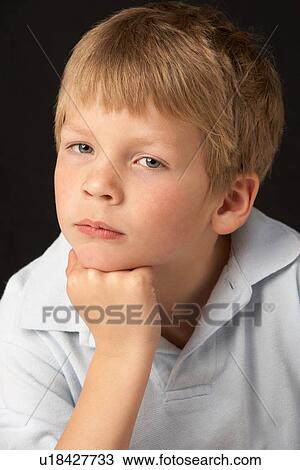 Studio Portrait Of Thoughtful Young Boy View Large Photo Image Stock Image - Studio Portrait Of Thoughtful Young Boy. Fotosearch