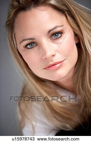 Studio Portrait Of Woman Wearing White Shirt View Large Photo Image Stock Image - Studio Portrait Of Woman Wearing White Shirt. Fotosearch