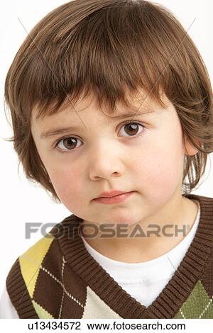 Stock Image - Studio Portrait Of Young Boy. Fotosearch