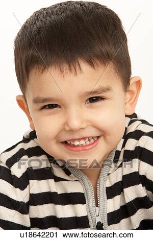 Stock Image - Studio Portrait Of Young Boy. Fotosearch