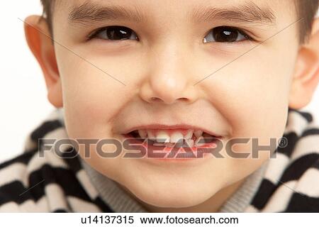 Stock Photography - Studio Portrait Of Young Boy. Fotosearch