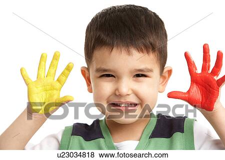 Stock Photo - Studio Portrait Of Young Boy With Painted Hands. Fotosearch