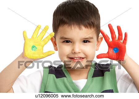 Stock Photography - Studio Portrait Of Young Boy With Painted Hands. Fotosearch